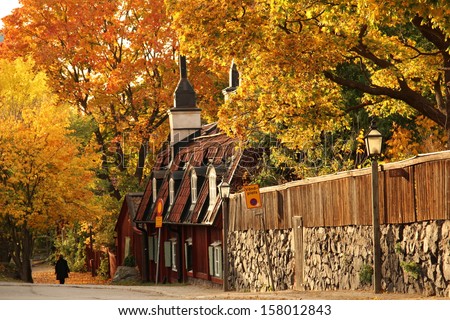 STOCKHOLM, SWEDEN - OCTOBER 11: Old red cottages in central Stockholm in autumn colors shown on October 11, 2013 in Stockholm.