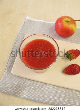 Strawberry apple smoothie in glass
