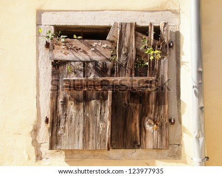old shutters 29,  closed with wooden planks