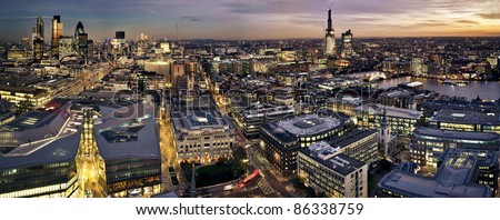 London at twilight panoramic view from St. Paul\'s Cathedral. This view includes Tower 42 Gherkin,Willis Building, Stock Exchange Tower, Canary Wharf,  Tower Bridge and a construction of Shard Lo