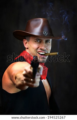 Cowboy with gun and smoking cigar