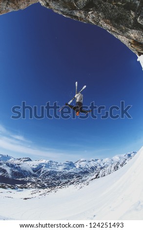 MANIITSOQ, GREENLAND - MAY 13: Free skier Anders Bjorndahl jump a back-flip off a cliff  on Appusuit Glacier near Maniitsoq on May 13, 2002. Appusuit is a popular area for snow skiing in Greenland.