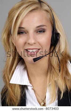 a friendly woman with blond hair and headphone