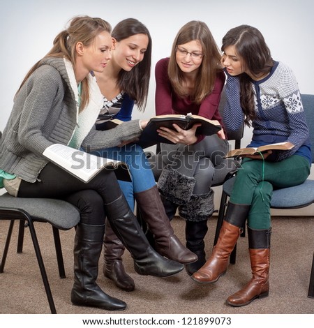 Young woman teacher teach God\'s Words to a women team