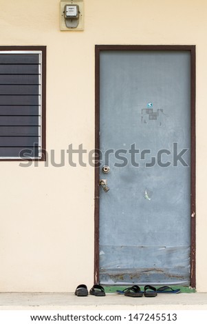 Front of apartment door with shoes