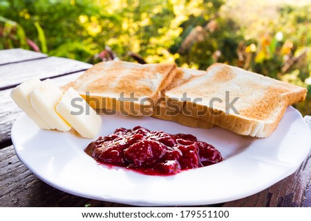 toast with butter and strawberry jam