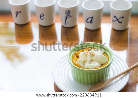 pumpkin pudding topped with whipped cream