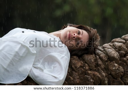 beautiful woman in rainy park