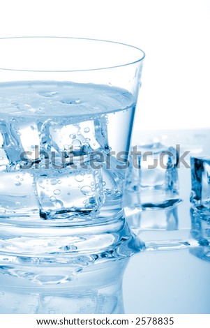 Glass Of Fresh Water With Cubes Of Ice In It Over Paper Background ...