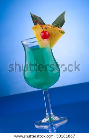 Blue Hawaiian cocktail. Rum, pineapple juice, coconut milk and blue curacao garnished with slice of pineapple and maraschino cherry. Most popular cocktails series.