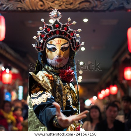 Chengdu - December 29 2014: Chinese artist perform traditional face-changing art or bianlian onstage at Chunxifang Chunxilu on December 29, 2014 in Chengdu, Sichuan Province in China