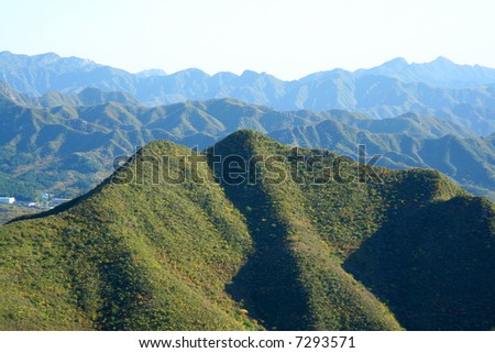 Mountains covered by green trees. China