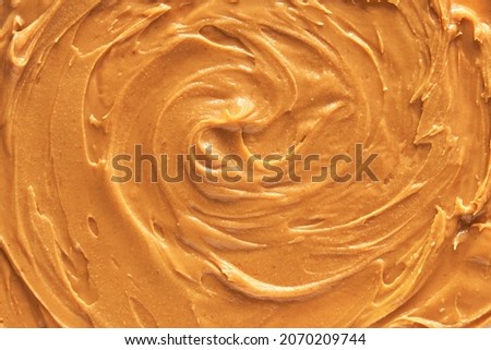 Peanut butter texture. Spread swirl. Organic keto food. Healthy creamy paste. Smooth closeup brown desert. Crunchy macro snack. Fat salt breakfast Photo stock © 