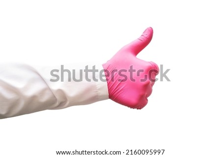 Thumb up in Medical glove. Surgery doctor hand. Medicine healthcare operation equipment. Specialist clean hospital arm. Sanitation protection gesture. Sterile hygiene concept. Approval sign. Pink Stock foto © 