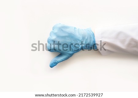 Medical glove. Surgery doctor hand. Medicine healthcare operation equipment. Specialist clean hospital arm. Sanitation protection gesture. Sterile hygiene concept. Negative approval. Blue color Stock foto © 