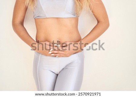 Image, Stock Photo Thoughtful young female athlete listening to music in studio