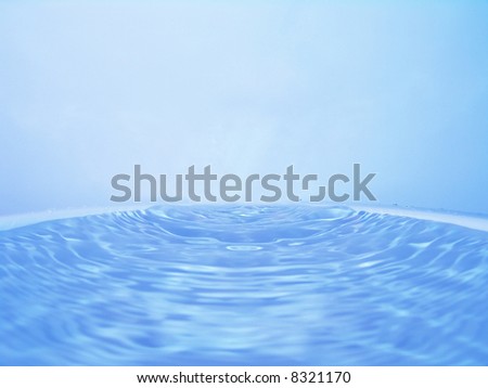 Close-up water flowing with ripples on water surface