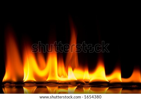 Red hot fire burns on a reflective surface, set against a black background. Flat, front on perspective.