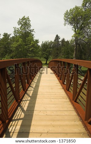 Iron and wood bridge over creek
