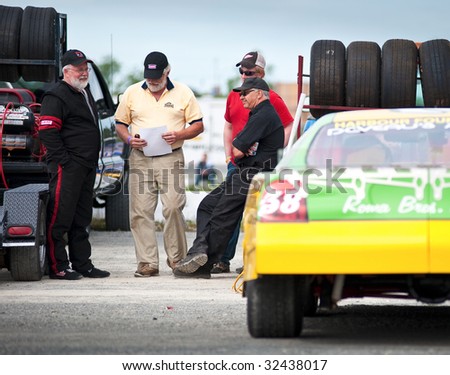HALIFAX, NS - JUNE 19: Race car drivers and pit crew chat prior to racing action at Scotia Speedworld, June 19, 2009.