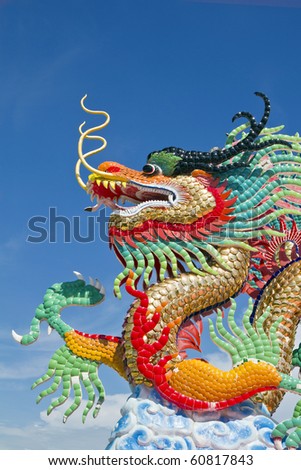 many color dragons on blue sky ( , at take a photograph in the vertical ) , a city is Nakolsawun , Thailand ,