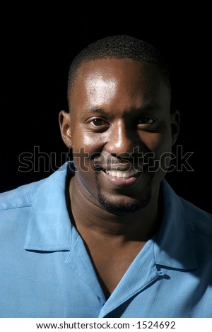 Low Key Portrait Headshot On Black Background Of A Handsome Smiling ...