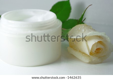 Face cream - Close-up of a face cream with a rose flower on top