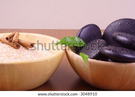 Massage stones and bath salt - Massage stones on wooden background, theme: wellness products, health and beauty, spa products