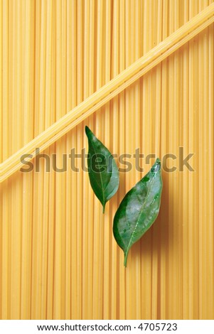 Pasta - uncooked pasta macro view, food ingredients. Raw farfalle