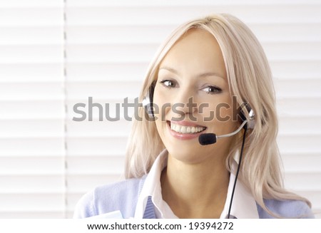 A friendly secretary/telephone operator in an office