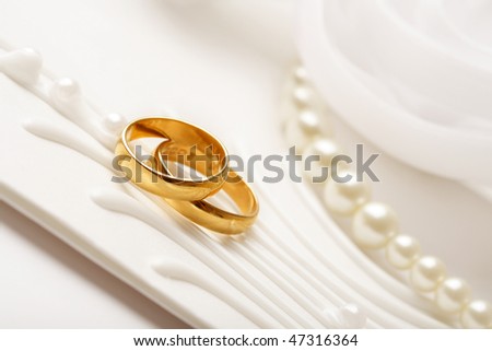 two golden wedding rings, wedding invitation