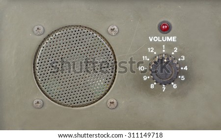 old style dial volume switch with speaker and red light indicator