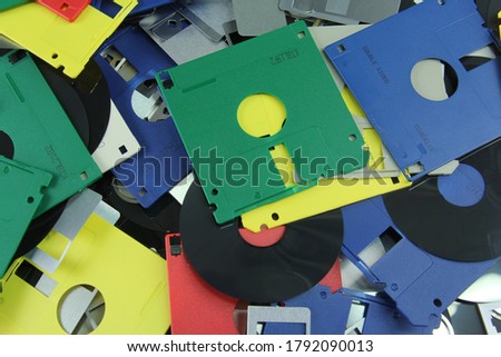 Similar – Image, Stock Photo A discarded floppy disk looks wistfully at the USB stick, which the mouse pointer prefers