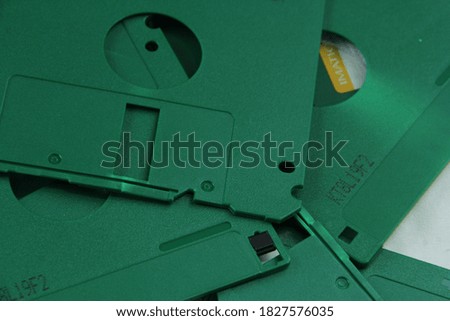 Similar – Image, Stock Photo A discarded floppy disk looks wistfully at the USB stick, which the mouse pointer prefers