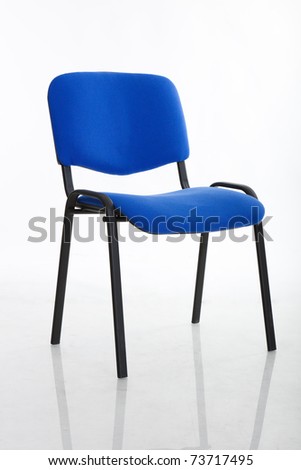 a basic cloth covered office chair, isolated on white