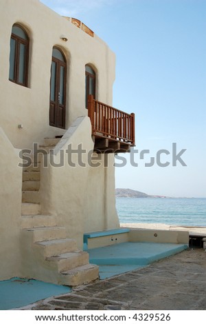 A vacation home in the Greek islands with a beautiful blue sky.