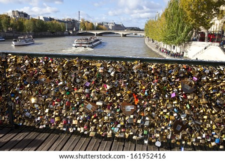 PARIS, FRANCE - NOV 3RD 2013: The Love Padlocks on Pont des Arts in Paris on 3rd November 2013.