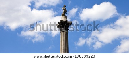 LONDON, UK - JUNE 12TH 2014: A panoramic view of Nelson\'s Column amongst the clouds in London on 12th June 2014.