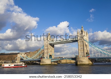 LONDON, UK - 4TH MARCH 2015: The beautiful view of Tower Bridge in London with a City Cruise boat on 4th March 2015.