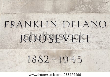 LONDON, UK - APRIL 7TH 2015: The name and date plaque on the podium of the Franklin D. Roosevelt (32nd President of the United States) statue in Grosvenor Square in London on 7th April 2015.
