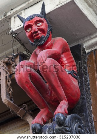 The famous Little Red Devil statue located in Stonegate, York.