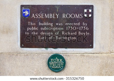 YORK, UK - AUGUST 25TH 2015: A plaque detailing the history of the Assembly Rooms building in York, on 25th August 2015.
