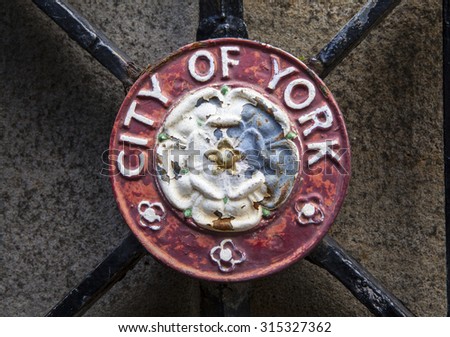 YORK, UK - AUGUST 25TH 2015: A metal plaque of the crest of the City of York, on 25th August 2015.