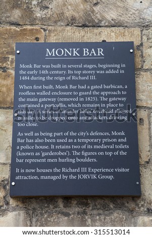 YORK, UK - AUGUST 25TH 2015: An information plaque at the historic Monk Bar in York, on 25th August 2015.