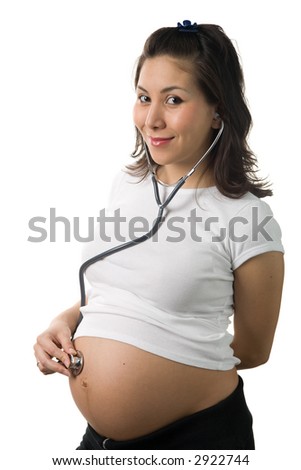 A pregnant woman listening heart beat of unborn child