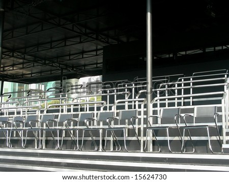 Empty seats in the audience area at an outdoor
