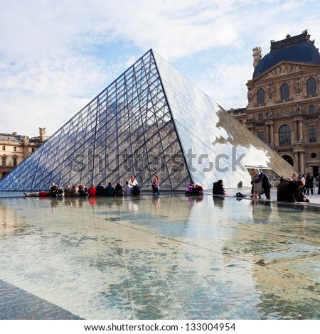 PARIS, FRANCE - MARCH 5: Louvre and Pyramid. in 1983 architect I. M. Pei was awarded the project and proposed a glass pyramid to stand over a new entrance in the main court, in Paris on March 5, 2013