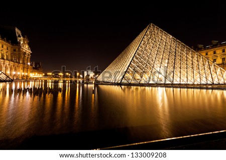 PARIS, FRANCE - MARCH 8: Louvre and Pyramid. in 1983 architect I. M. Pei was awarded the project and proposed a glass pyramid to stand over a new entrance in the main court, in Paris on March 8, 2013