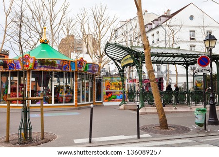 PARIS, FRANCE - MARCH 5: Abbesses station on Paris Metro in Montmartre. Station entrance is one of only two original glass covered Guimard entrances, called edicules in Paris, France on March 5, 2013