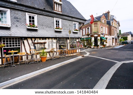 ETRETAT, FRANCE - JULY 1: street (Rue Alphonse Karr) small provincial town Etretat in France on July 1, 2010. The town is known for its cliffs, including three natural arches and the pointed \